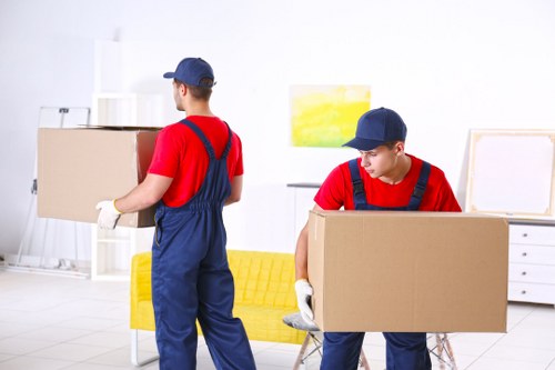 Customer complaint form beside moving boxes for a removal company