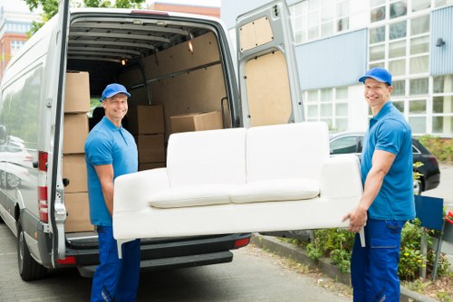 Removal team carrying boxes safely during a move