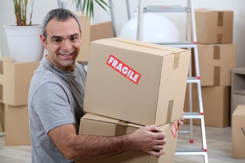 Careful packing for Belgravia flat removals with boxes and protective materials