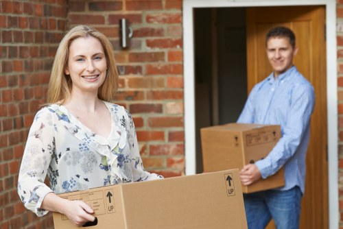 Movers assessing cubic-yard volume for a flat in Belgravia
