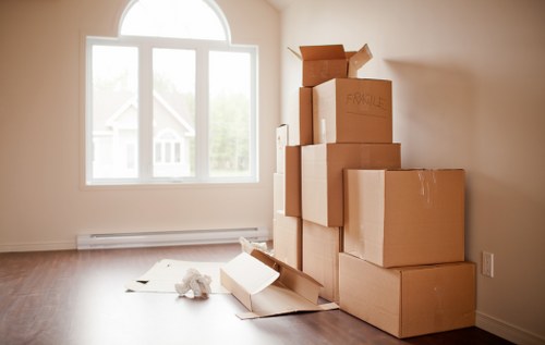Local movers transporting furniture on a Belgravia street