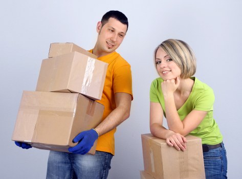 Moving crew handling furniture during a relocation