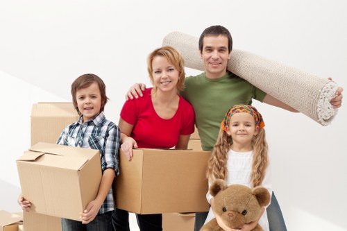 Team organising an office move in Belgravia with labelled boxes and equipment