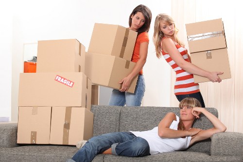 Commercial office moving service preparing furniture and IT equipment